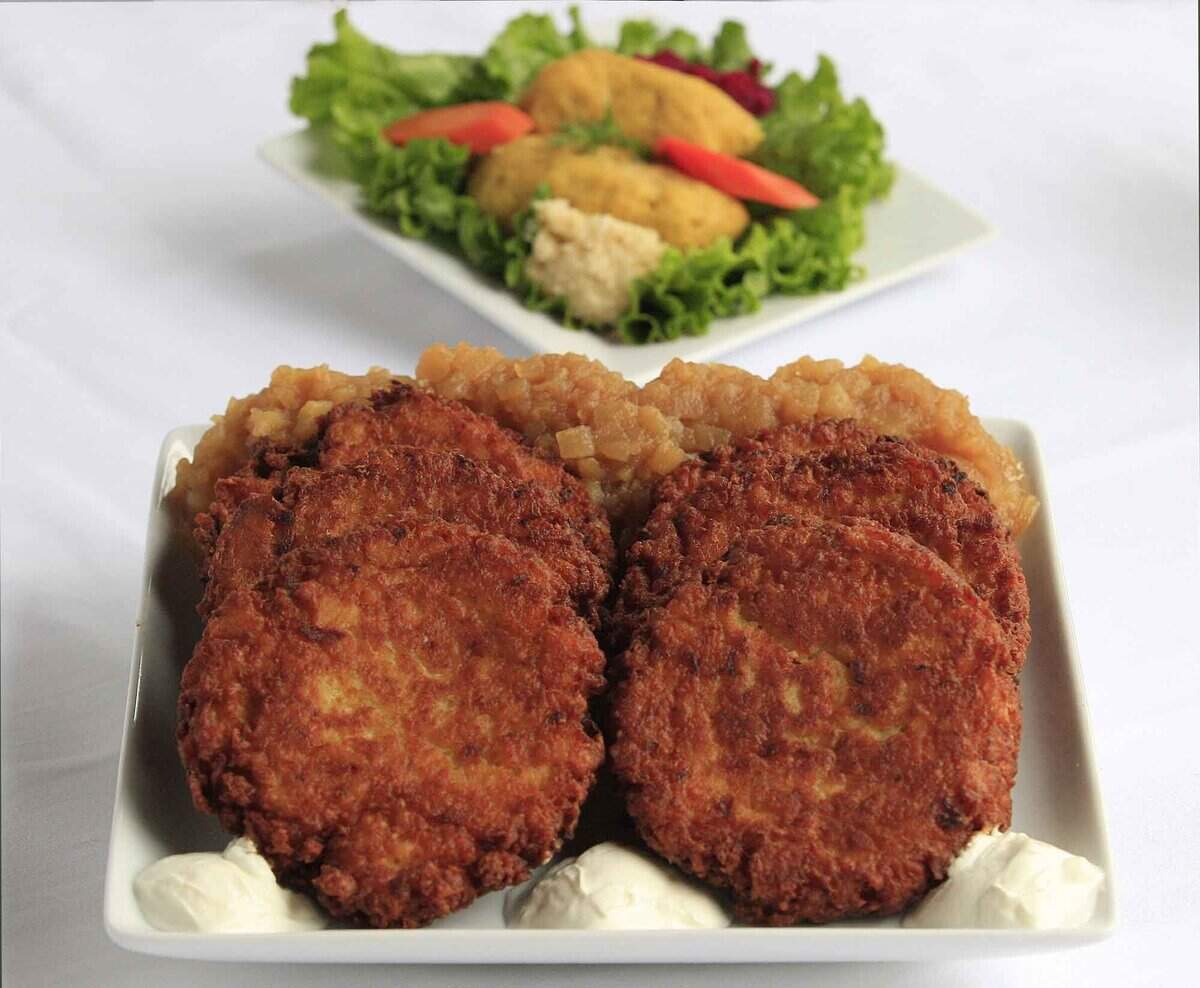 In 2010, a platter of potato pancakes with apple sauce and sour cream, and a plate of gefilte fish, from the Epicure market in Miami Beach.